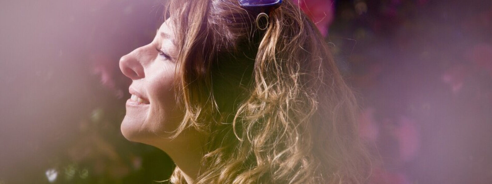 Side profile of a woman wearing headphones