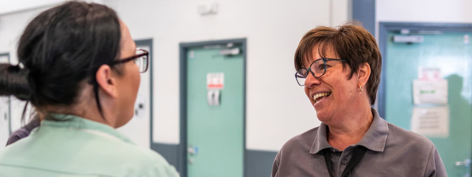 Two medial staff have a conversation