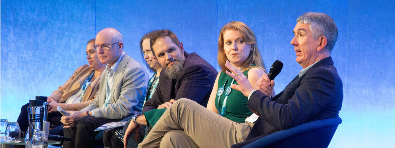 A panel of speakers on stage at the UK Biobank scientific conference