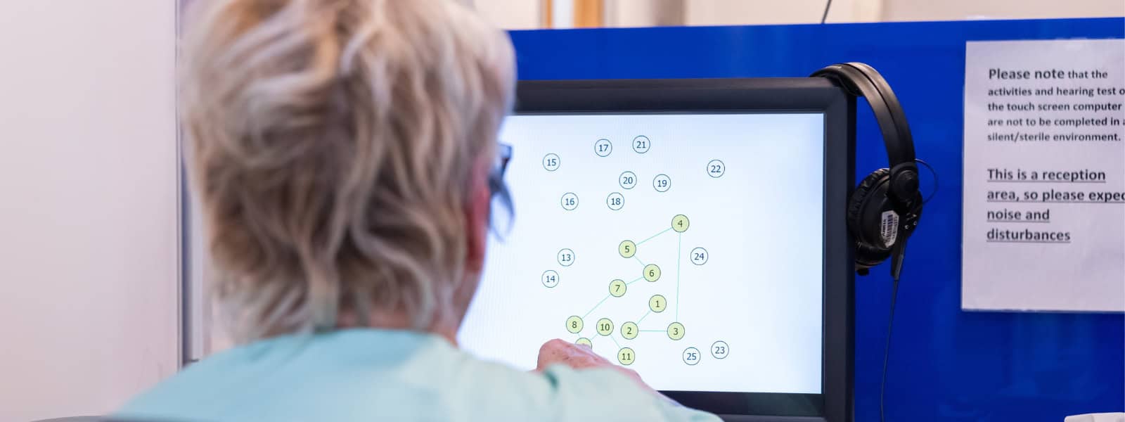 A participant completes a test on a screen
